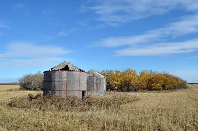 Old granaries in a harvested field
