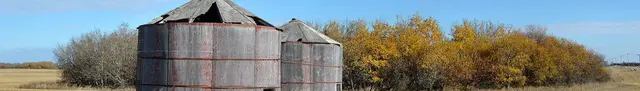 Old wooden granaries in autumn