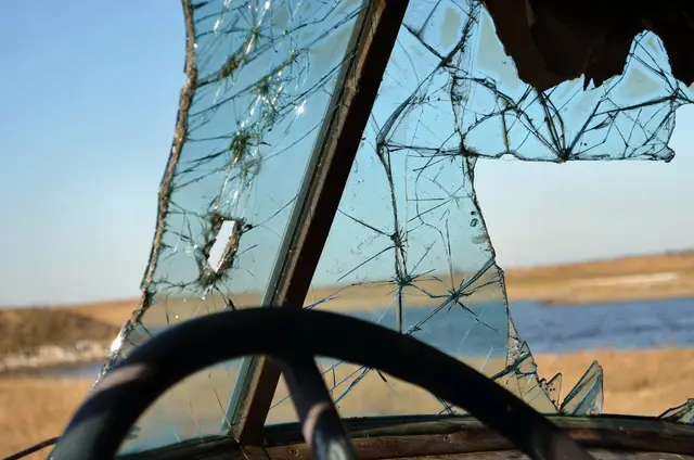 Cracked windshield of abandoned vehicle